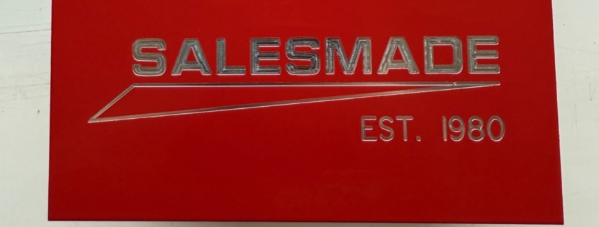 black and red powdercoated aluminium blocks with engraved salesmade logo